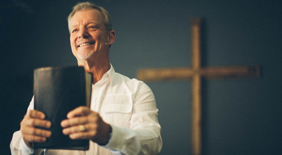 man holding Bible