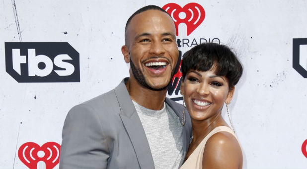 Actress Meagan Good (R) and husband Devon Franklin (L) pose at the 2016 iHeartRadio Music Awards in Inglewood, California, April 3, 2016.